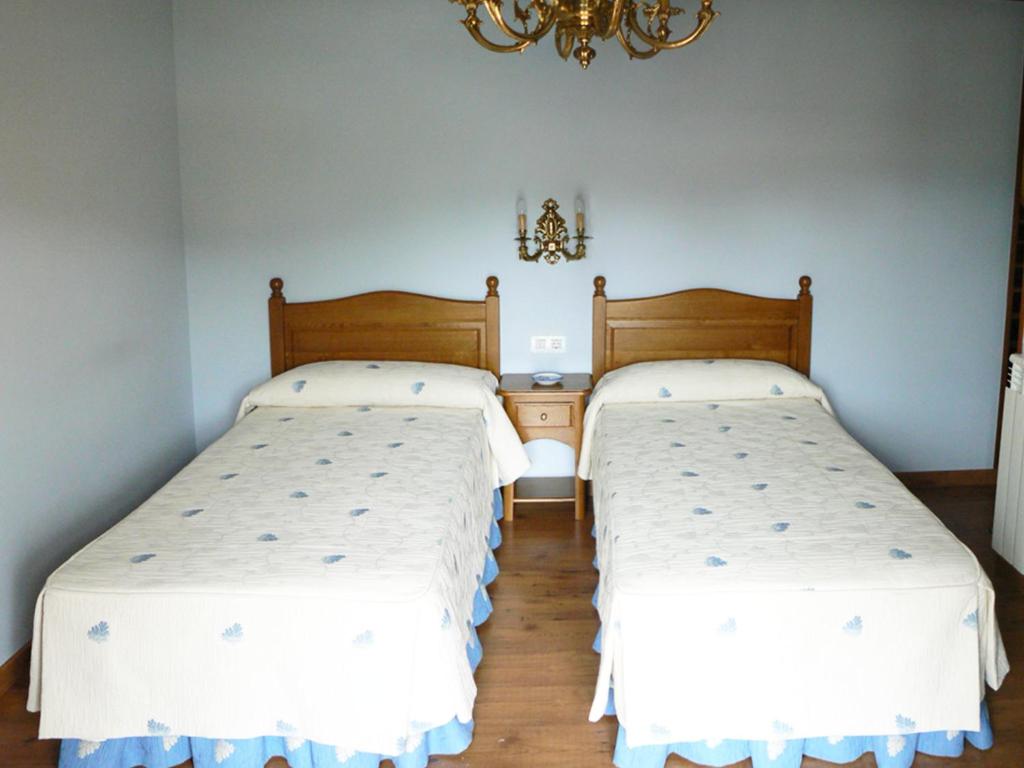 Postel nebo postele na pokoji v ubytování Posada Ribera del Pas