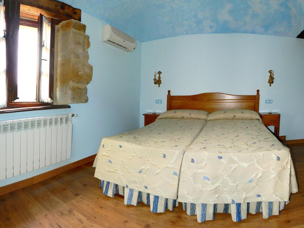 Postel nebo postele na pokoji v ubytování Posada Ribera del Pas