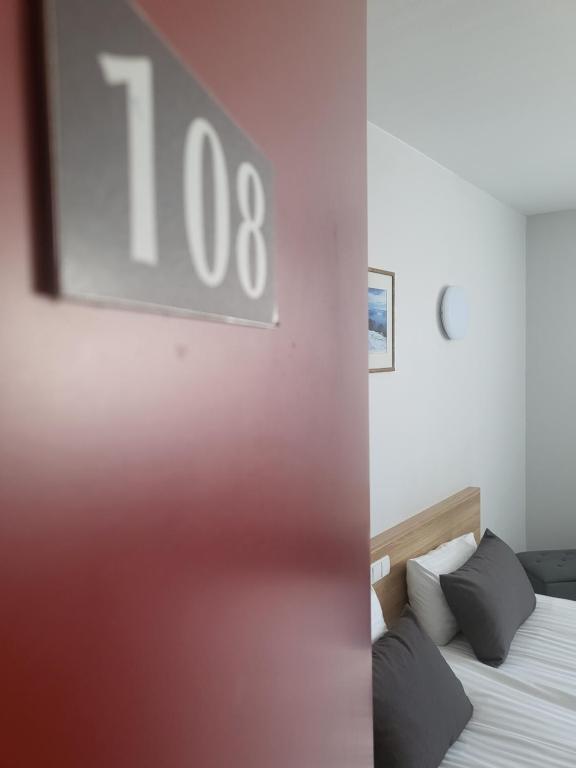 Postel nebo postele na pokoji v ubytování Green Vilnius Hotel