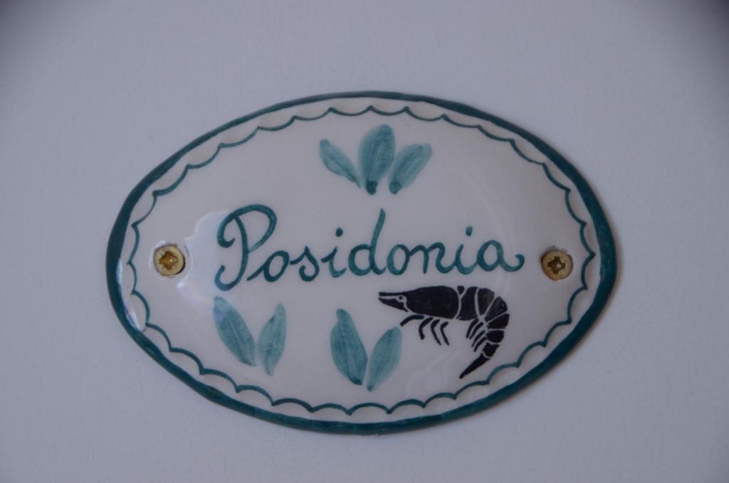 a plate with the name of postoria on it at Gambero Nero in Tellaro
