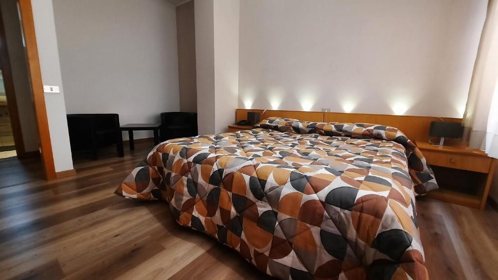 Postel nebo postele na pokoji v ubytování Hotel Del Viale