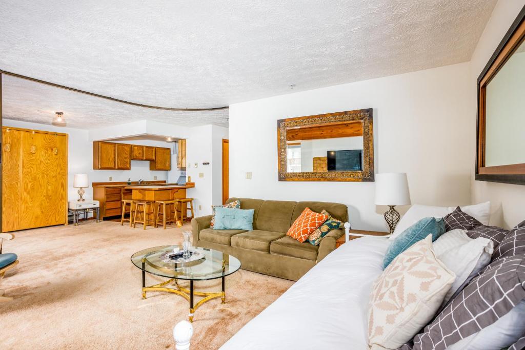 a living room with a couch and a table at Timberline Getaway in Girdwood