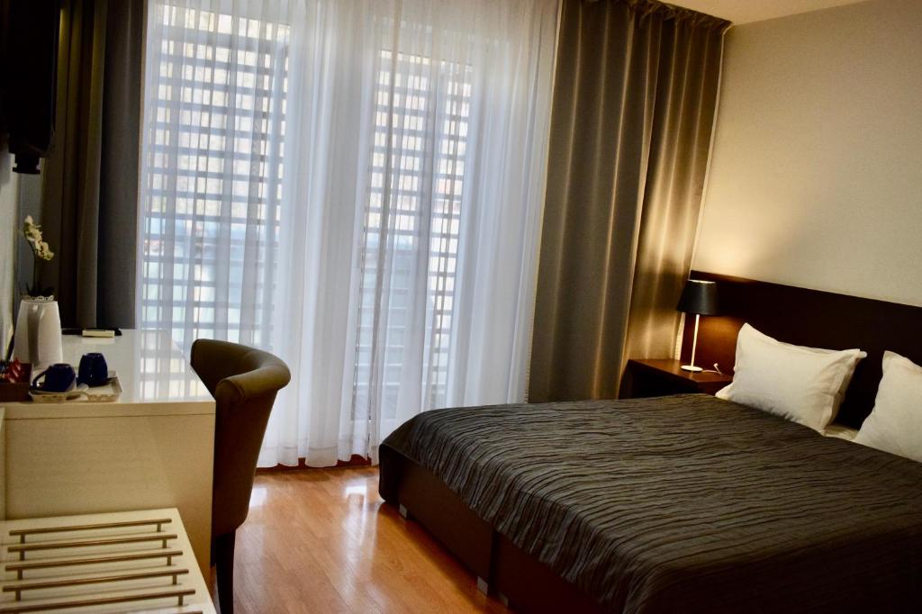 Postel nebo postele na pokoji v ubytování Hotel Divan
