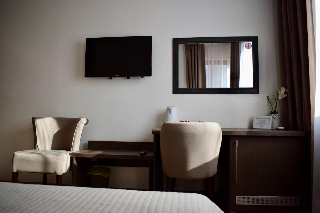 TV a/nebo společenská místnost v ubytování Hotel Divan
