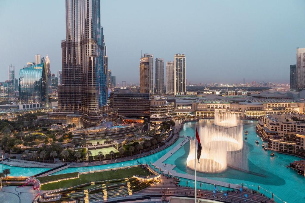 a view of a city with a fountain in the middle at Elite Royal Apartment - Full Burj Khalifa and Fountain View - Caesar in Dubai