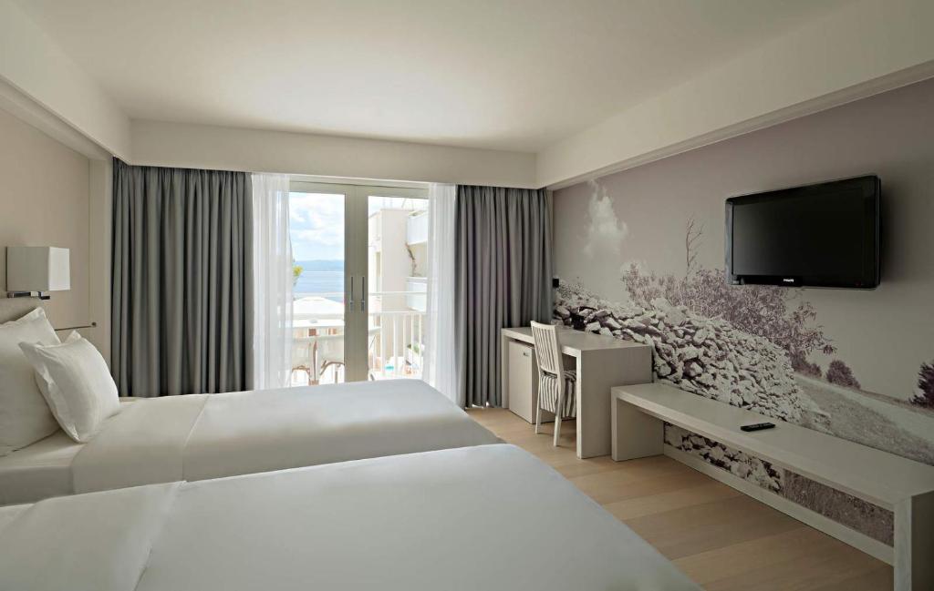 A bed or beds in a room at Hotel Osejava