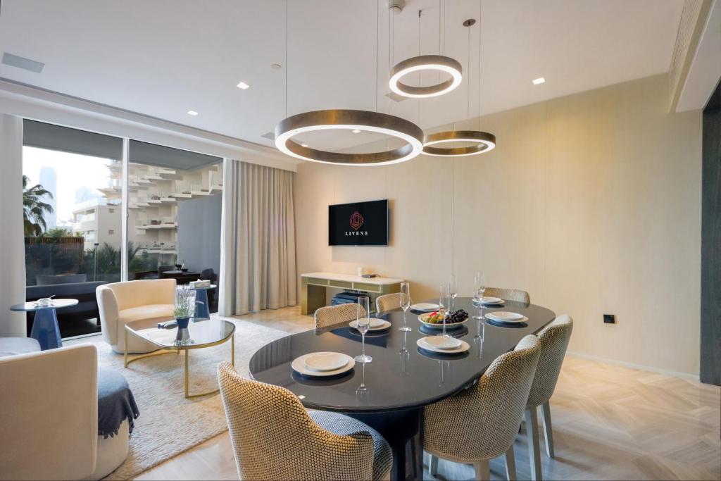 a dining room with a table and chairs at Five Palm - Residential 2 BR Suite with Private Beach -Livbnb in Dubai