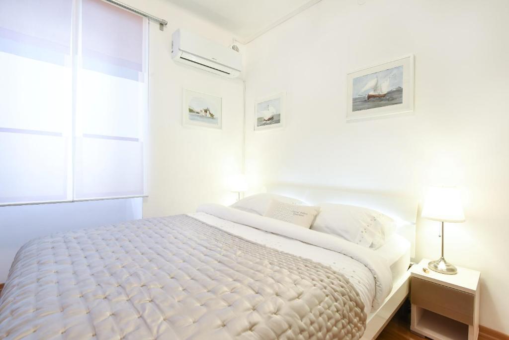 Posteľ alebo postele v izbe v ubytovaní Central Palace Apartment
