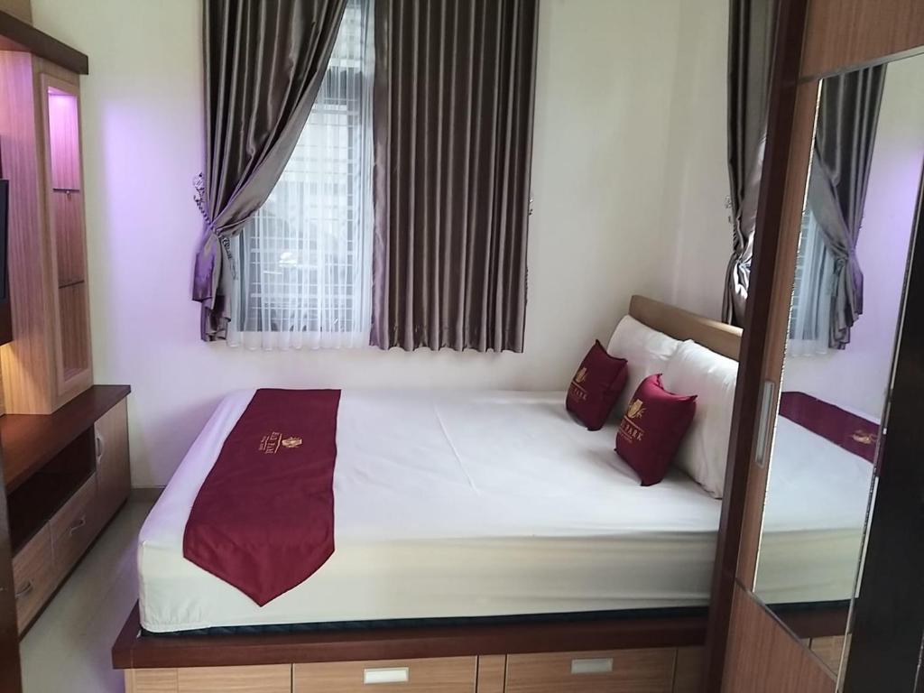 Postel nebo postele na pokoji v ubytování Prime House Muntilan
