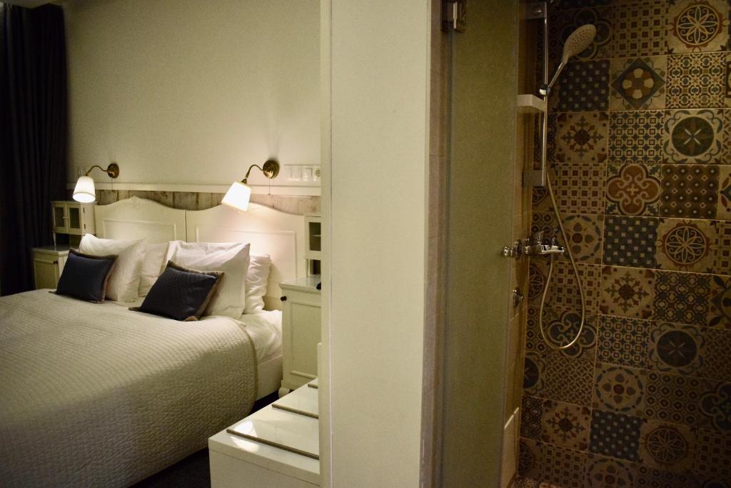 Postel nebo postele na pokoji v ubytování Hotel Divan
