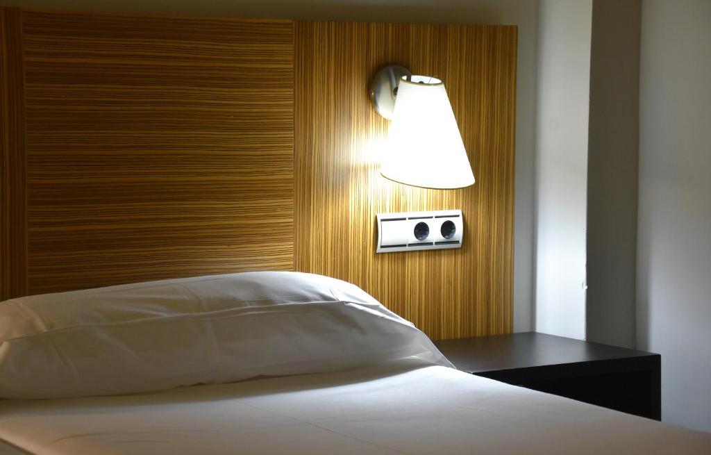 Postel nebo postele na pokoji v ubytování Hotel y Apartamentos SNÖ Isaba