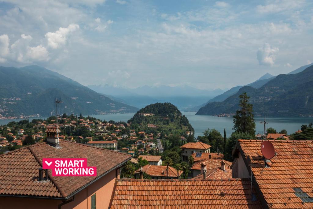 a view of a town with mountains and a lake at La Filanda Apartments by Wonderful Italy - Canapa in Bellagio