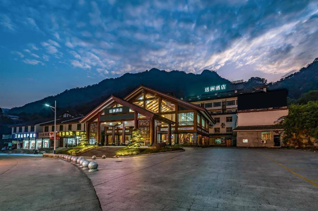 a hotel with a large building in the mountains at S&N Hotel Sanqingshan in Shangrao