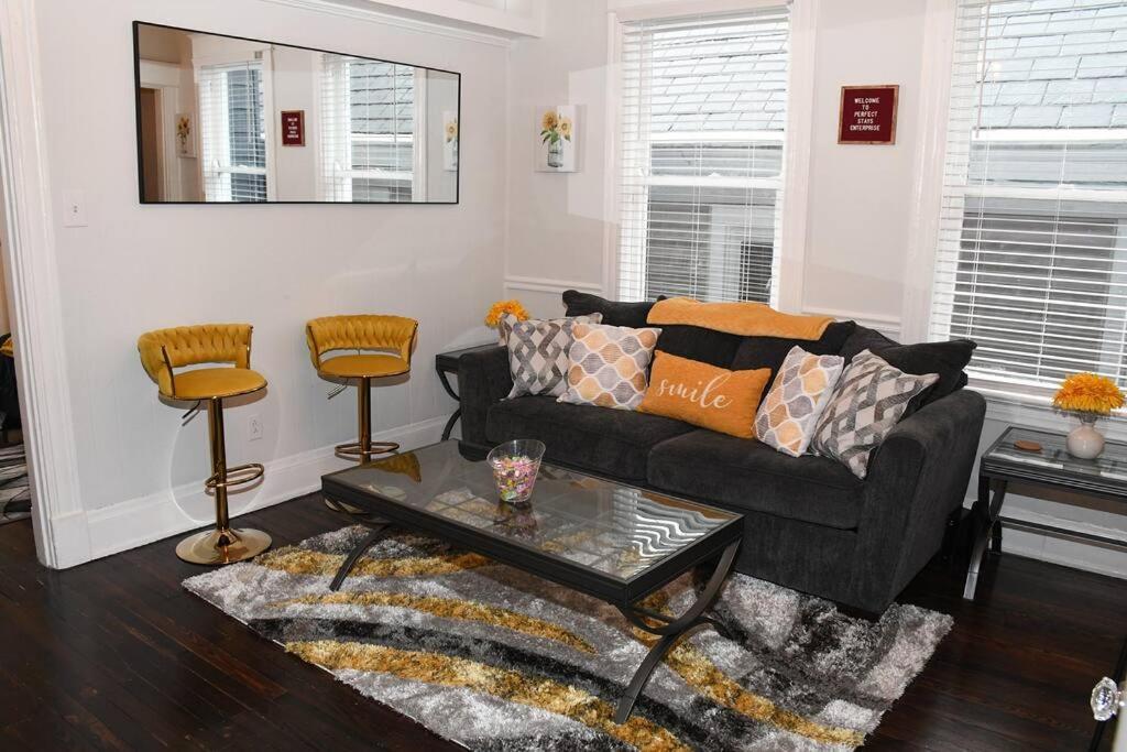 a living room with a couch and a table at Apt - Columbia Tusculum - Patio(2) in Cincinnati