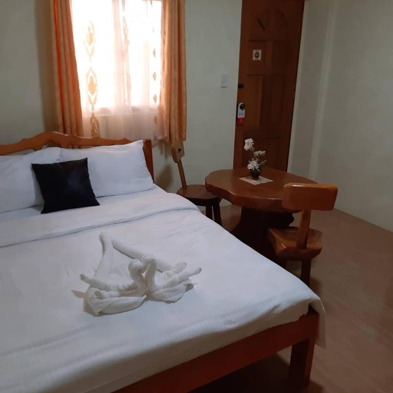 Postel nebo postele na pokoji v ubytování Binalonan Transient/GUESTHOUSE (PENSION GLAYDIE)