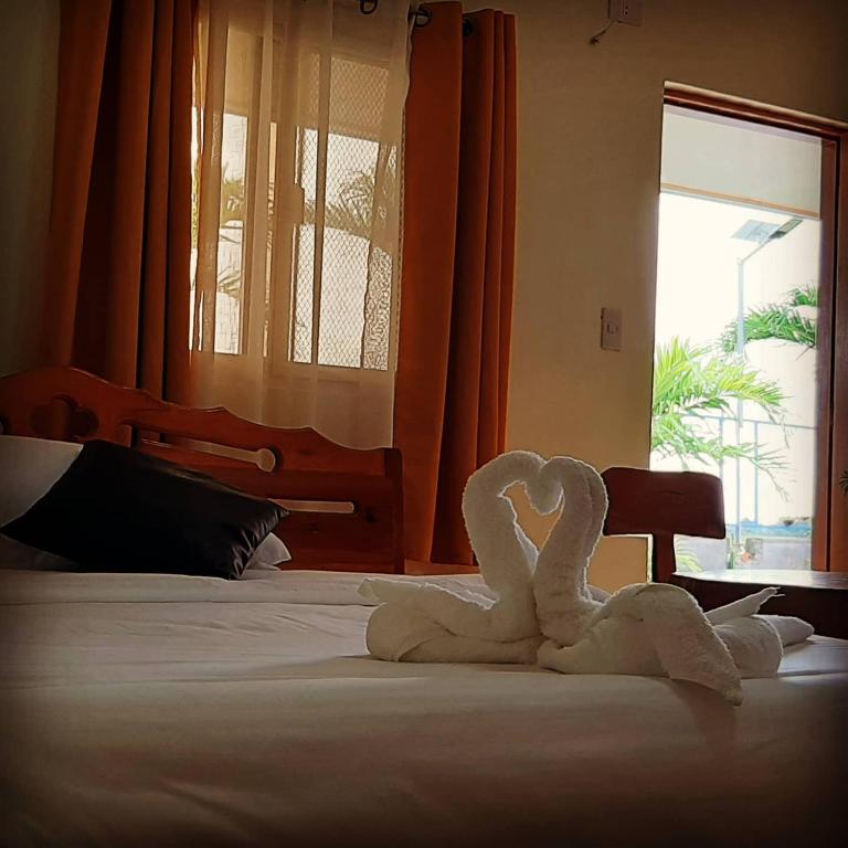 Postel nebo postele na pokoji v ubytování Binalonan Transient/GUESTHOUSE (PENSION GLAYDIE)