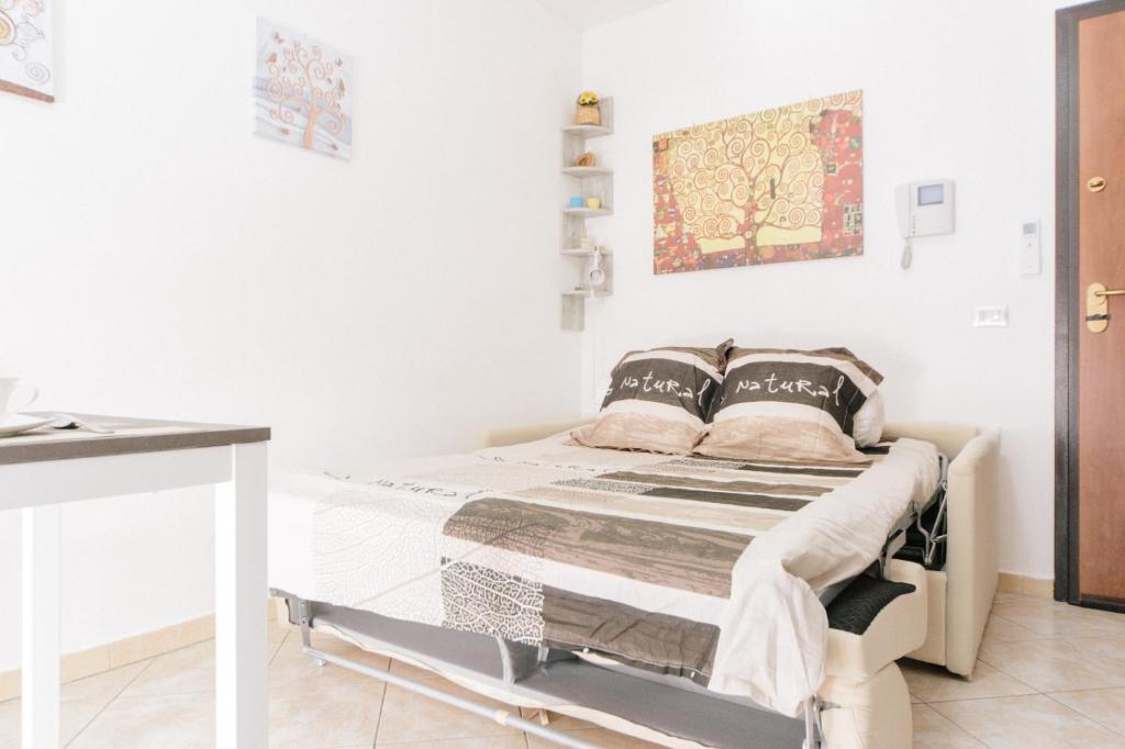 Łóżko lub łóżka w pokoju w obiekcie Lido Alghero Beach House