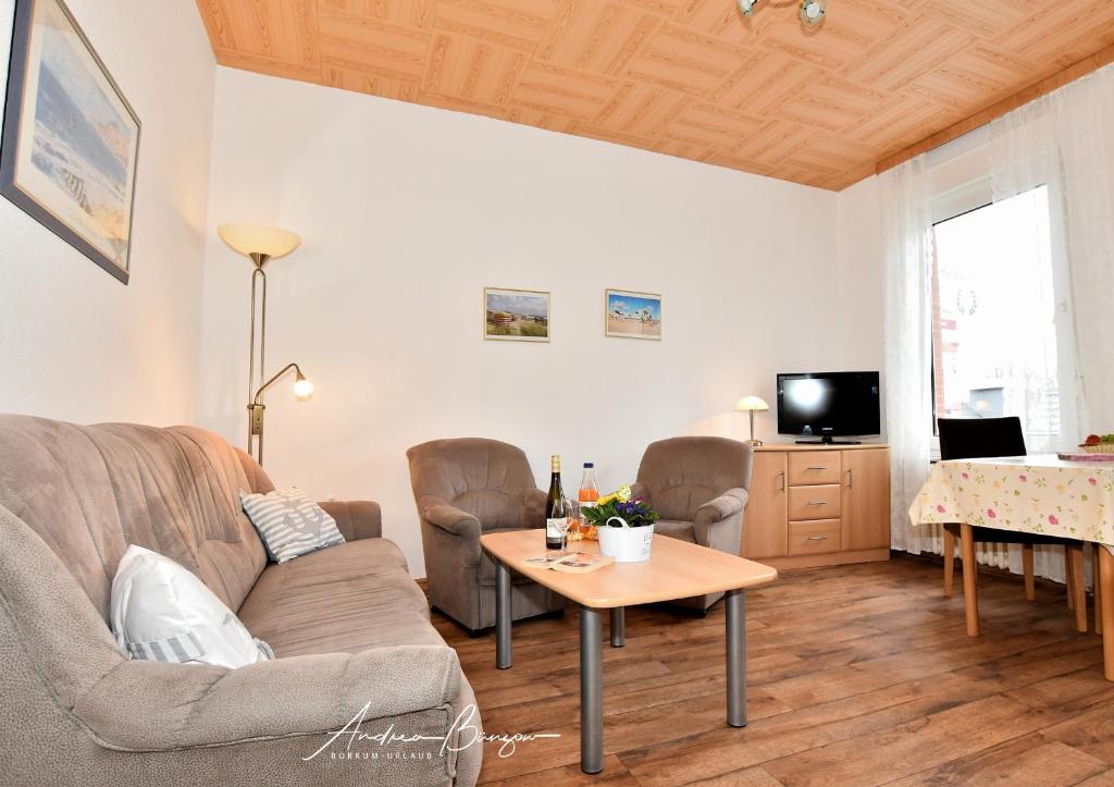 a living room with a couch and a table at Haus-Herrmann-1 in Borkum