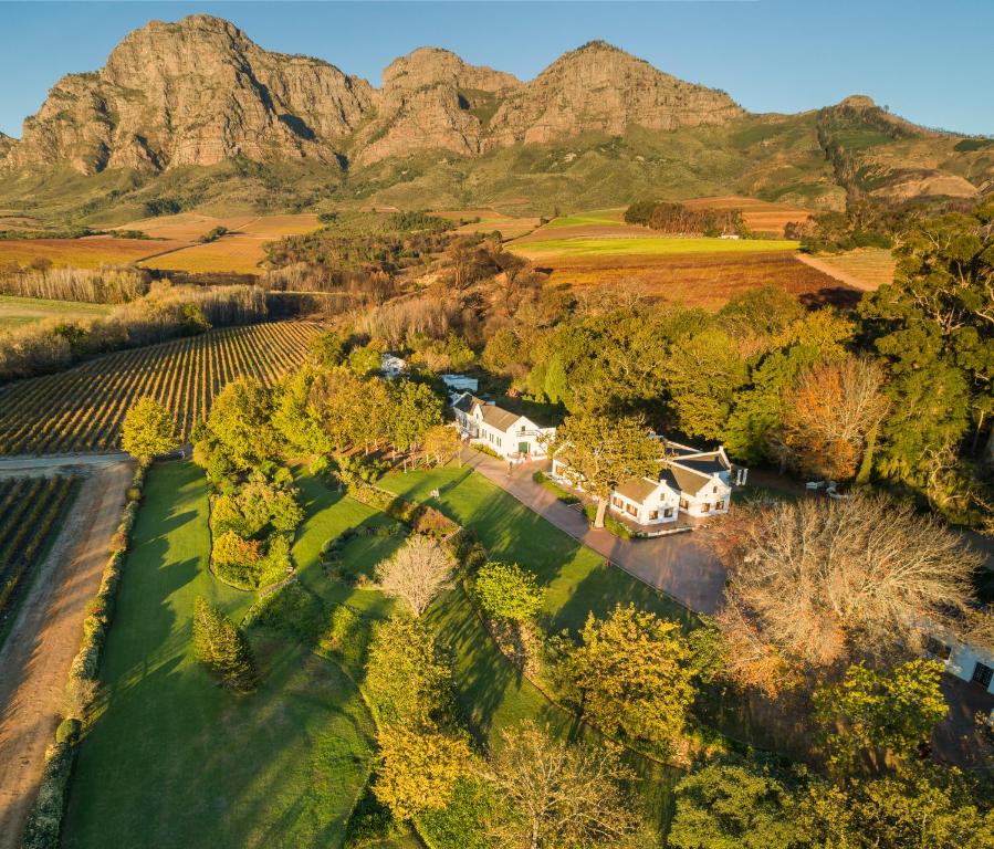 an aerial view of a estate with mountains in the background at Plaisir Estate Accommodation in Simondium
