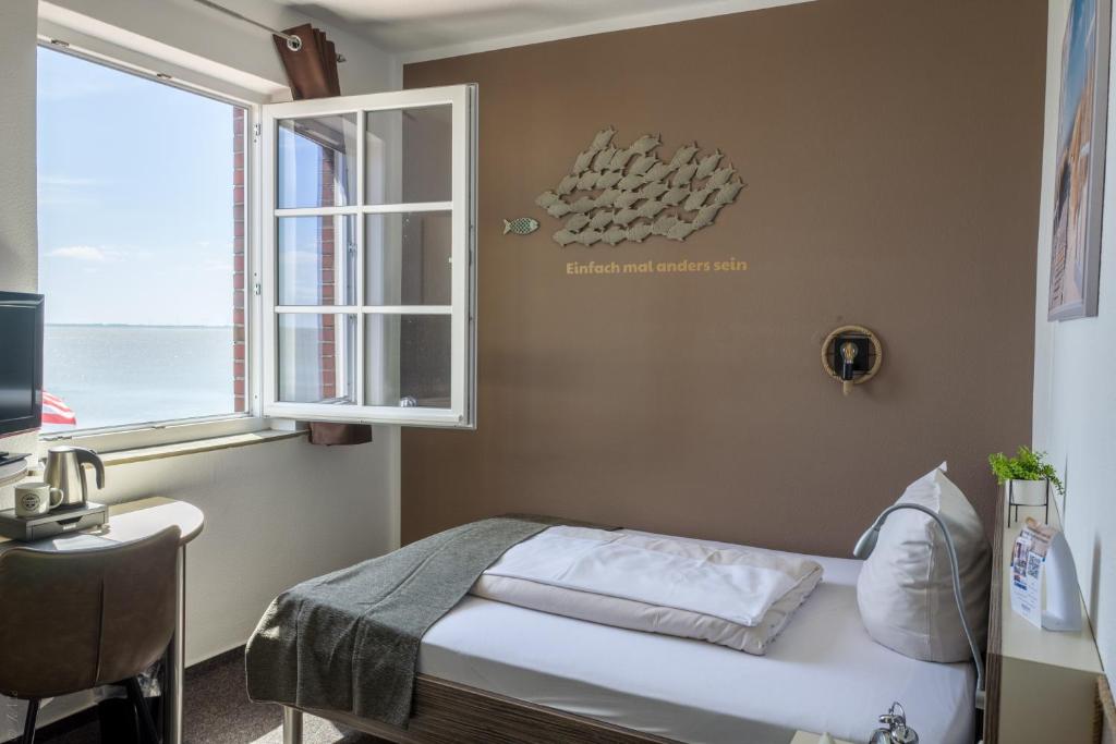 Postel nebo postele na pokoji v ubytování AKZENT Strandhotels Seestern, Delphin & Lachs
