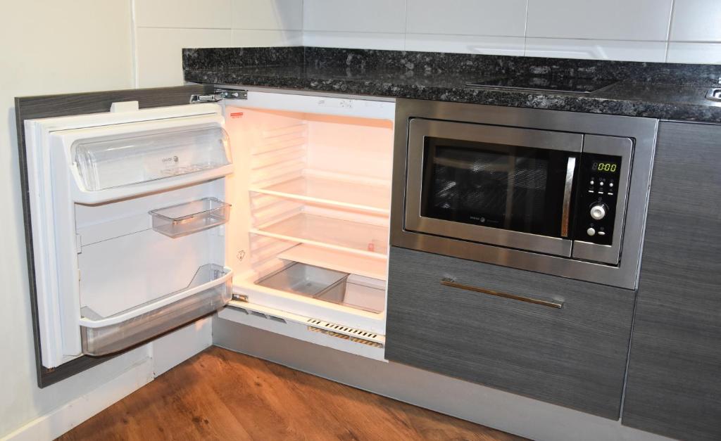 Kuchyň nebo kuchyňský kout v ubytování Hotel y Apartamentos SNÖ Isaba