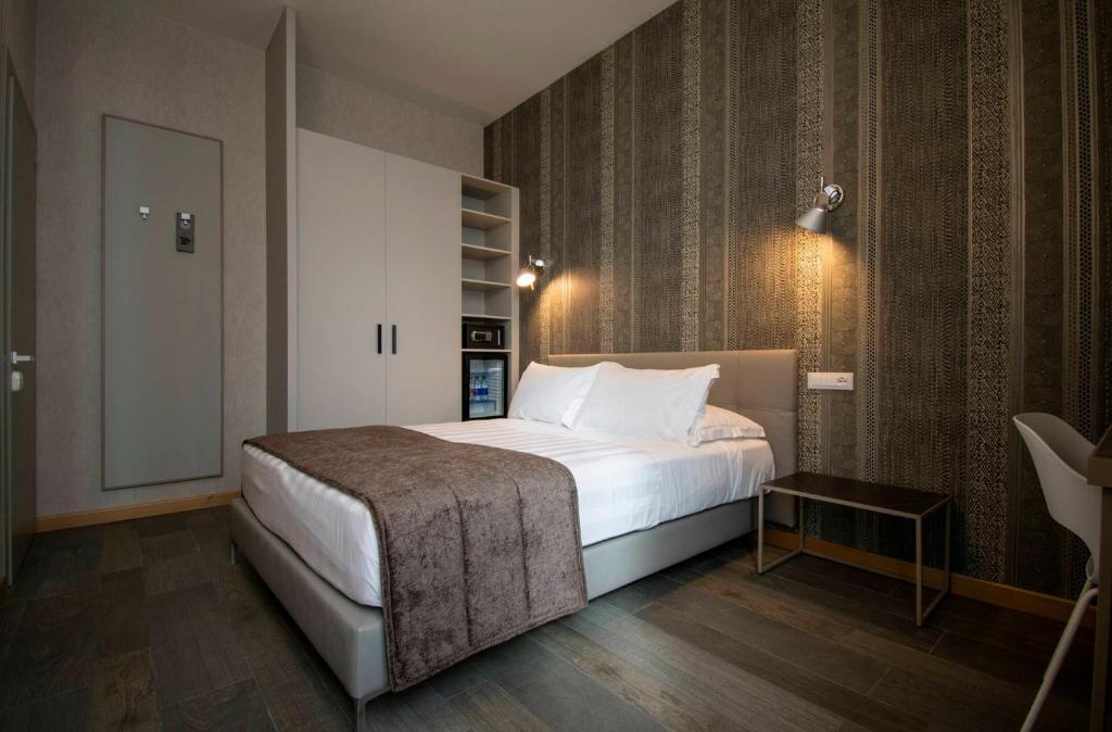 Postel nebo postele na pokoji v ubytování Hotel Medusa