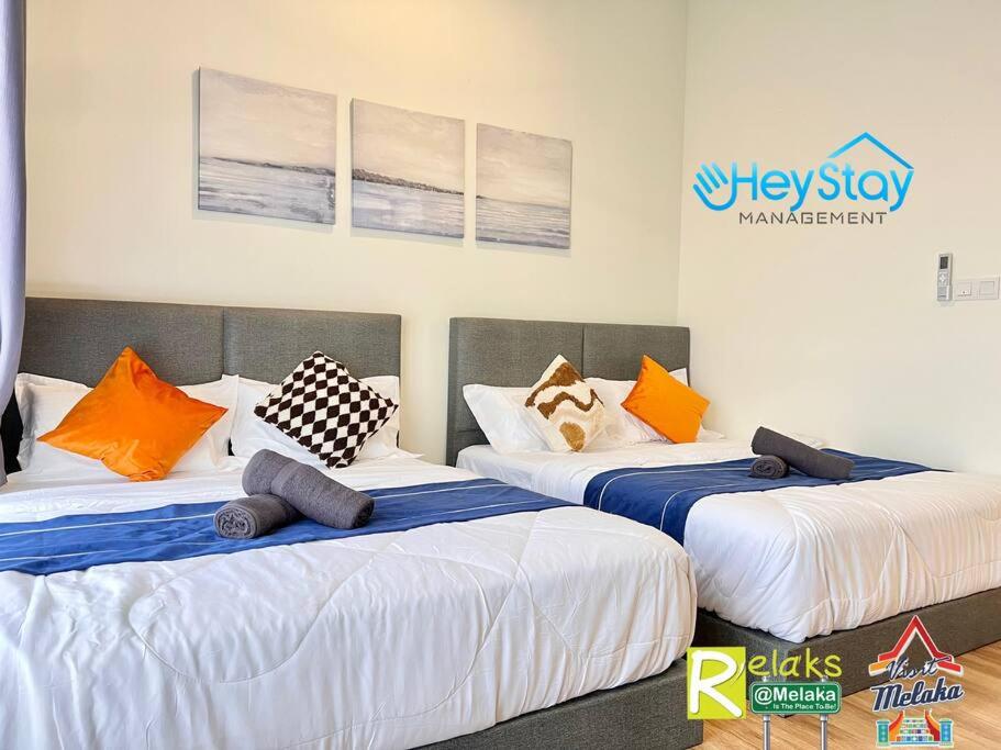 The Apple Residence By Heystay Management客房内的一张或多张床位
