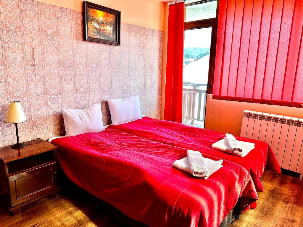 Postel nebo postele na pokoji v ubytování Family Hotel Carpe Diem
