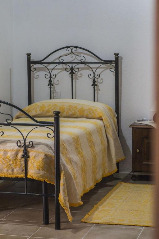 Postel nebo postele na pokoji v ubytování Albergo Diffuso Il Mandorlo