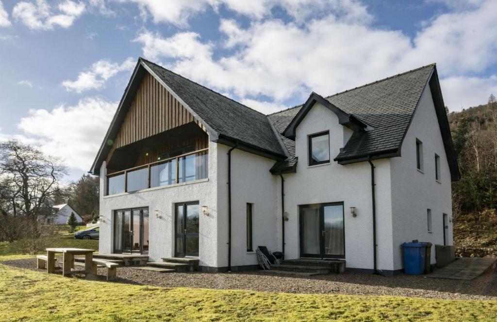 a white house with a black roof at Ardbrae in Spean Bridge