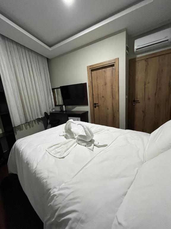 Postel nebo postele na pokoji v ubytování Gold Corner Hotel
