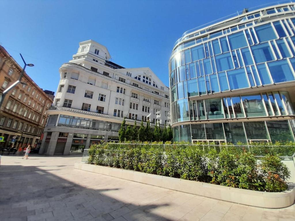 a group of buildings on a city street at Phoenix Apartment in Budapest
