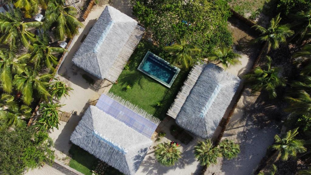 an overhead view of a house with a swimming pool at Casa Rosa Atins in Atins