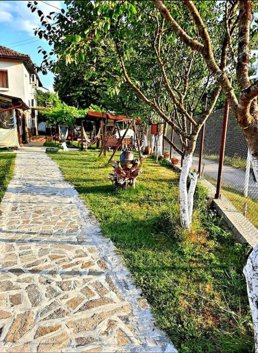 A garden outside Guest House By The River