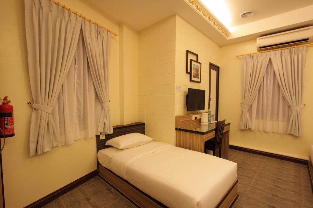Postel nebo postele na pokoji v ubytování Shamrock Guest House II