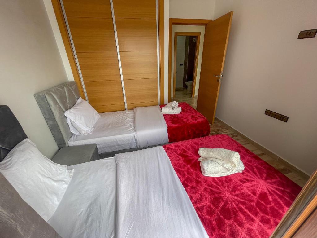 Voodi või voodid majutusasutuse Appart Terrasse Corniche Tanger toas