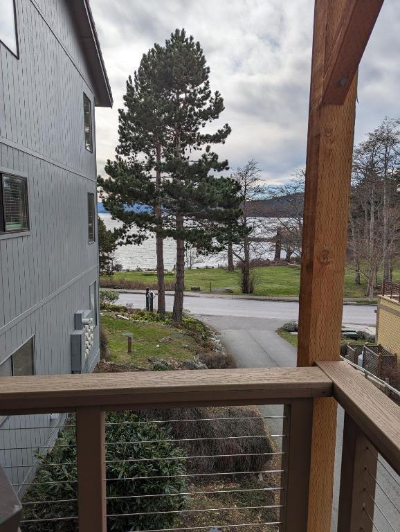 a view from the balcony of a house with a tree at The Landmark Inn on Orcas Island in Eastsound
