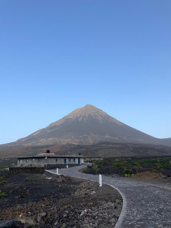 a mountain in the distance with a road in the foreground at Casa Ze & sonia in Portela