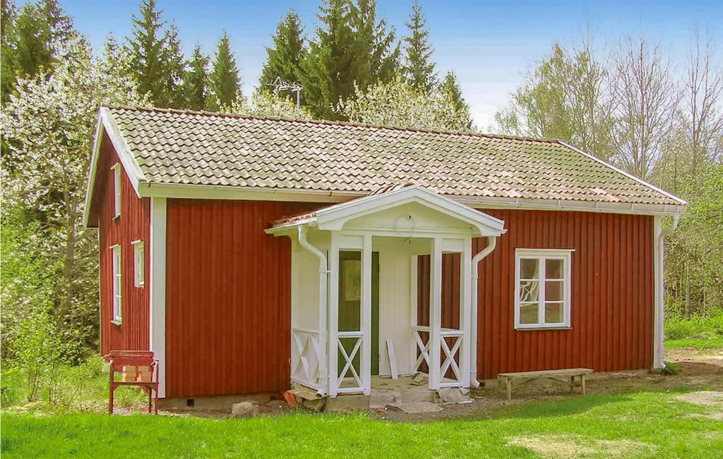 a red and white shed with a white door at Stunning Home In Vimmerby With Wifi in Vimmerby