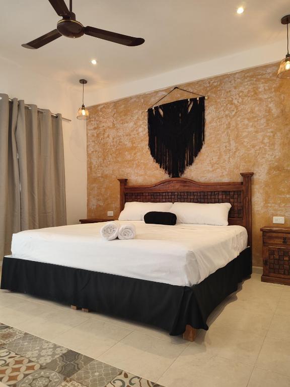 Postel nebo postele na pokoji v ubytování Hotel Casa Henequén