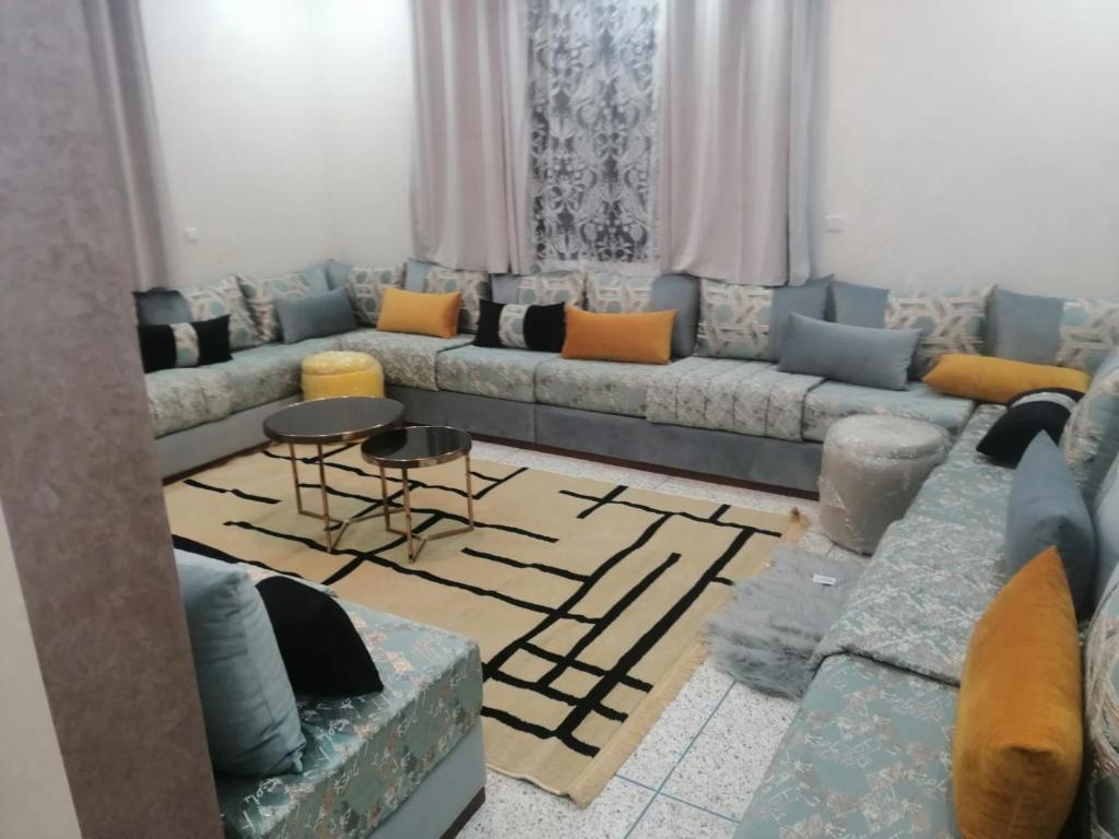 a living room with a couch and a table at Hassan Rabat in Rabat