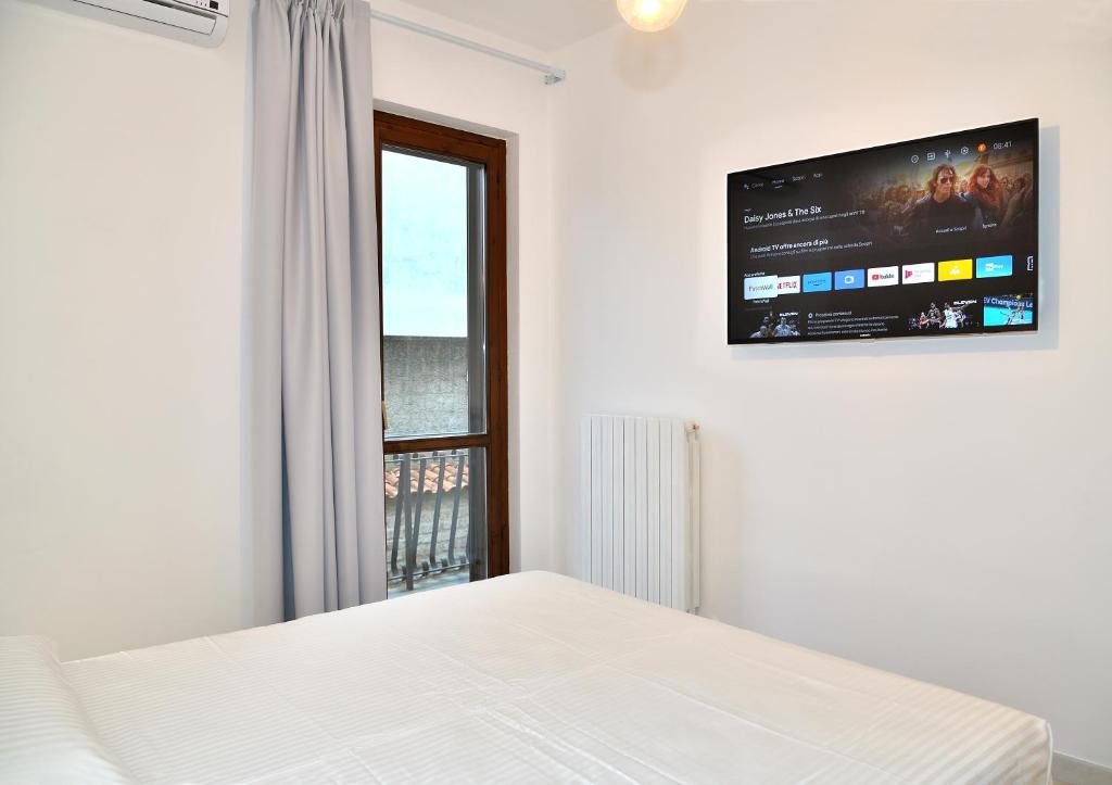 Postel nebo postele na pokoji v ubytování a CASA IDA