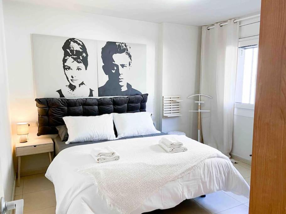 a bedroom with a large bed with a black headboard at ¡Más céntrico imposible! 6Pax+PK in Andorra la Vella