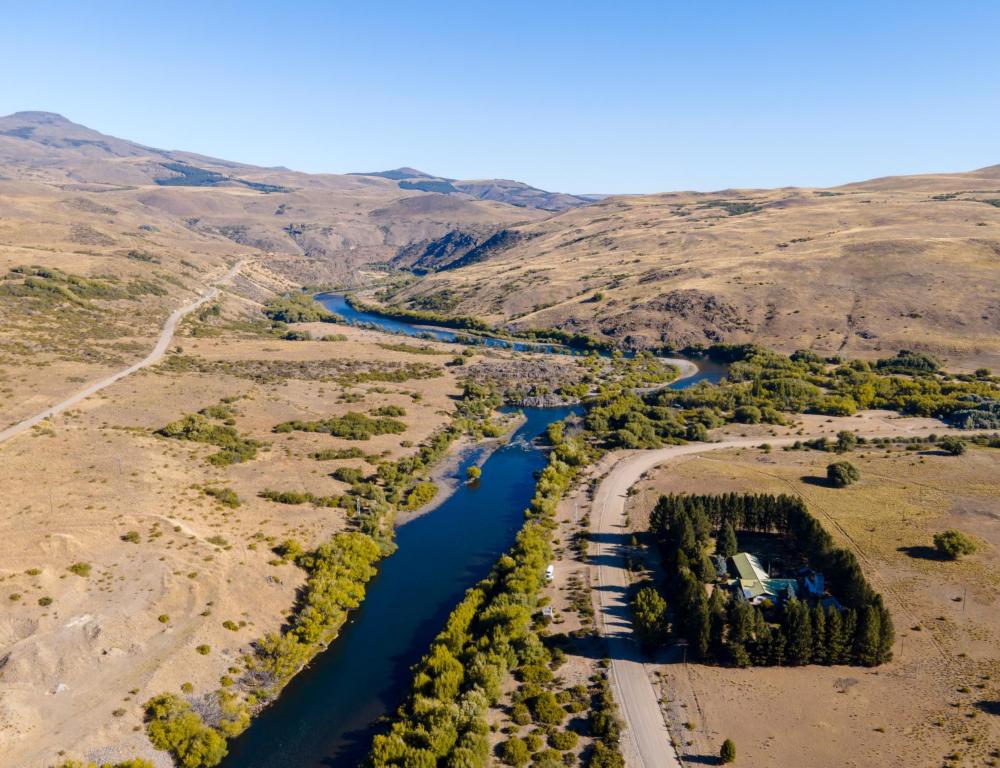 an aerial view of a river in the desert at Estancia Quillen Lodge - Hosteria in Aluminé