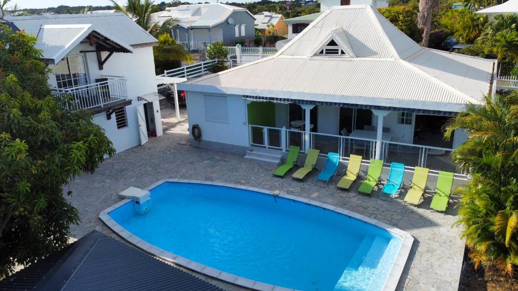 an aerial view of a house with a swimming pool at Villa MARIE-GALANTE -Sainte-Anne in Sainte-Anne