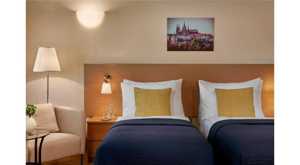 Łóżko lub łóżka w pokoju w obiekcie Mostecká 12 Residence