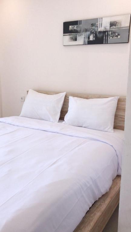 Postel nebo postele na pokoji v ubytování A-Manta Homestay