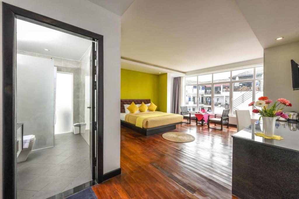 Postel nebo postele na pokoji v ubytování Hotel La Maravilla