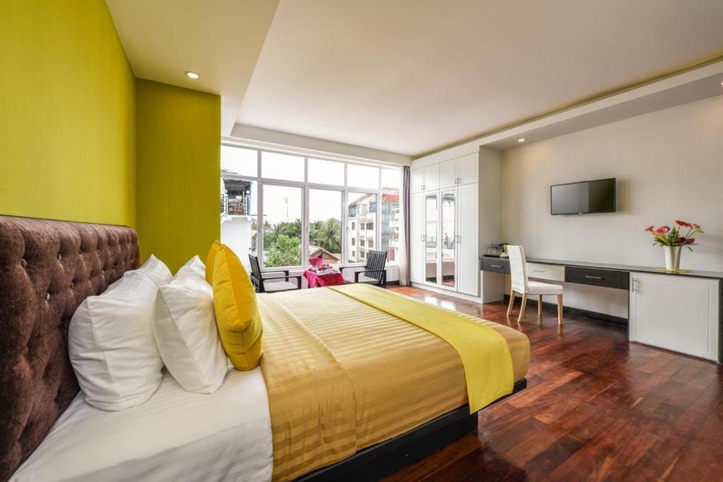 Postel nebo postele na pokoji v ubytování Hotel La Maravilla
