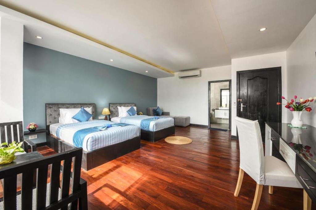 Postel nebo postele na pokoji v ubytování Hotel La Maravilla